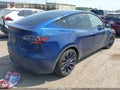 2023 Tesla Model Y — photo 4 of 20 | VIN 7SAYGDEF0PF965409