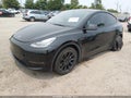 2021 Tesla Model Y — photo 2 of 15 | VIN 5YJYGAEE1MF183733