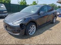 2024 Tesla Model Y — photo 2 of 16 | VIN 7SAYGDED9RF038152