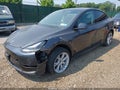 2024 Tesla Model Y — photo 6 of 16 | VIN 7SAYGDED9RF038152