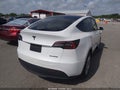 2023 Tesla Model Y — photo 4 of 18 | VIN 7SAYGDEE4PA145516