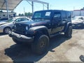 2015 Jeep Wrangler Unlimited — photo 2 of 15 | VIN 1C4BJWDGXFL566626