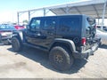2015 Jeep Wrangler Unlimited — photo 3 of 15 | VIN 1C4BJWDGXFL566626