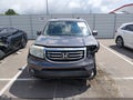 2014 Honda Pilot — photo 12 of 16 | VIN 5FNYF3H43EB002764