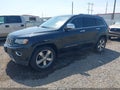 2014 Jeep Grand Cherokee — photo 2 of 11 | VIN 1C4RJEBT7EC191608