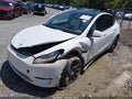 2022 Tesla Model Y — photo 2 of 14 | VIN 7SAYGAEE2NF328914