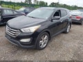 2015 Hyundai Santa Fe — photo 2 of 17 | VIN 5XYZWDLA5FG256865