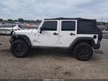 2011 Jeep Wrangler Unlimited — photo 14 of 16 | VIN 1J4BA3H19BL537644