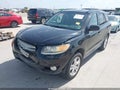 2012 Hyundai Santa Fe — photo 2 of 16 | VIN 5XYZK4AG2CG096717