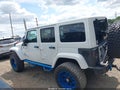 2012 Jeep Wrangler Unlimited — photo 14 of 16 | VIN 1C4HJWEG5CL152786