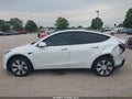 2022 Tesla Model Y — photo 12 of 14 | VIN 7SAYGAEE0NF401570