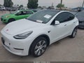 2022 Tesla Model Y — photo 2 of 14 | VIN 7SAYGAEE0NF401570