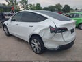 2022 Tesla Model Y — photo 3 of 14 | VIN 7SAYGAEE0NF401570