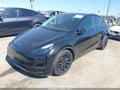 2025 Tesla Model Y — photo 2 of 18 | VIN 7SAYGDEE6SF299530