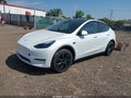 2025 Tesla Model Y — photo 2 of 18 | VIN 7SAYGDEE8SF245260