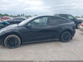 2023 Tesla Model Y — photo 14 of 18 | VIN 7SAYGAEE0PF703945
