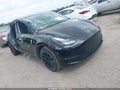 2023 Tesla Model Y — photo 1 of 18 | VIN 7SAYGAEE0PF703945