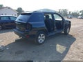 2014 Jeep Compass — photo 4 of 15 | VIN 1C4NJCBA2ED725707