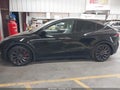 2023 Tesla Model Y — photo 12 of 14 | VIN 7SAYGDEF7PF913338