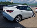 2023 Tesla Model Y — photo 4 of 15 | VIN 7SAYGAEE2PF591181
