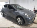 2023 Tesla Model Y — photo 1 of 15 | VIN 7SAYGDEE1PA032302