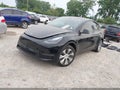 2023 Tesla Model Y — photo 2 of 16 | VIN 7SAYGDEEXPA212152
