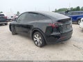 2023 Tesla Model Y — photo 3 of 16 | VIN 7SAYGDEEXPA212152