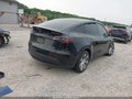 2023 Tesla Model Y — photo 4 of 16 | VIN 7SAYGDEEXPA212152