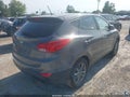2014 Hyundai Tucson — photo 4 of 11 | VIN KM8JTCAFXEU938809