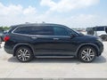 2016 Honda Pilot — photo 13 of 17 | VIN 5FNYF6H99GB093488