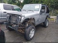 2014 Jeep Wrangler — photo 2 of 14 | VIN 1C4AJWAGXEL142328