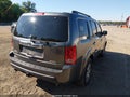 2011 Honda Pilot — photo 4 of 16 | VIN 5FNYF4H57BB043537