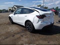 2024 Tesla Model Y — photo 3 of 19 | VIN 7SAYGDED4RF203945