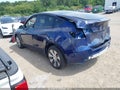 2023 Tesla Model Y — photo 3 of 22 | VIN 7SAYGAEE6PF668960