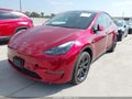 2024 Tesla Model Y — photo 2 of 18 | VIN 7SAYGAEE2RF210044