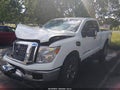 2017 Nissan Titan — photo 2 of 16 | VIN 1N6AA1C36HN573025