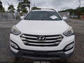 2014 Hyundai Santa Fe — photo 12 of 16 | VIN 5XYZU3LB4EG168901
