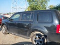 2015 Honda Pilot — photo 14 of 16 | VIN 5FNYF4H50FB073355