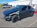 2026 Tesla Model Y — photo 2 of 22 | VIN 7SAYGDEE4TF604024