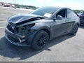 2025 Tesla Model Y — photo 2 of 15 | VIN 7SAYGDED9SA377092