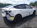 2024 Tesla Model Y — photo 4 of 19 | VIN 7SAYGAEE5RF993361