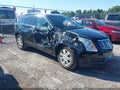 2016 Cadillac SRX — photo 1 of 16 | VIN 3GYFNBE3XGS560499