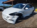 2024 Tesla Model Y — photo 2 of 14 | VIN 7SAYGDEE9RA225834