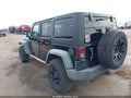 2011 Jeep Wrangler Unlimited — photo 3 of 16 | VIN 1J4HA6H1XBL566887