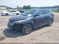 2015 Hyundai Santa Fe — photo 2 of 12 | VIN 5XYZU3LBXFG260452