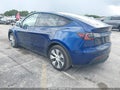 2023 Tesla Model Y — photo 3 of 18 | VIN 7SAYGAEE6PF850531