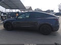 2022 Tesla Model Y — photo 14 of 16 | VIN 7SAYGAEE0NF389792