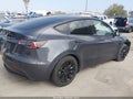 2022 Tesla Model Y — photo 4 of 16 | VIN 7SAYGAEE0NF389792