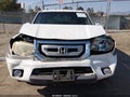 2011 Honda Pilot — photo 12 of 16 | VIN 5FNYF3H77BB014079