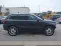 2012 Jeep Grand Cherokee — photo 13 of 16 | VIN 1C4RJFAT7CC228774